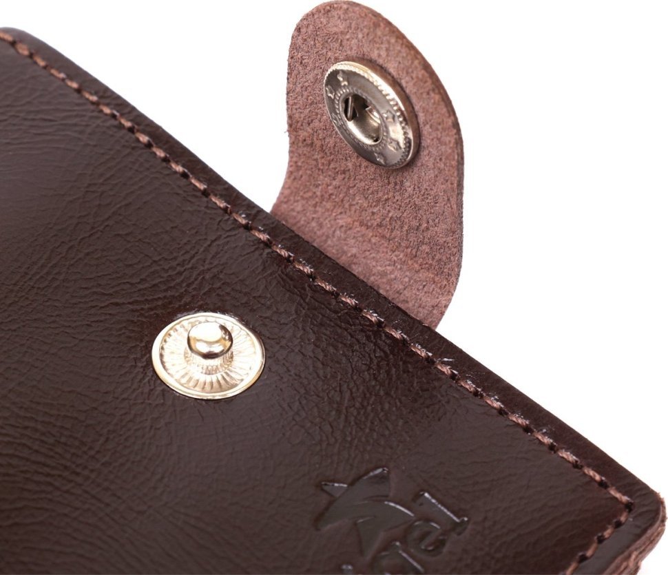 Кожаное мужское портмоне коричневого цвета с хлястиком на кнопке Shvigel (2416443)