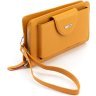 Шкіряний жіночий гаманець-клатч оранжевого кольору з кистьовим ремінцем Karya 67503