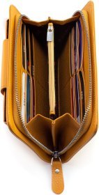 Кожаный женский кошелек-клатч оранжевого цвета с кистевым ремешком Karya 67503