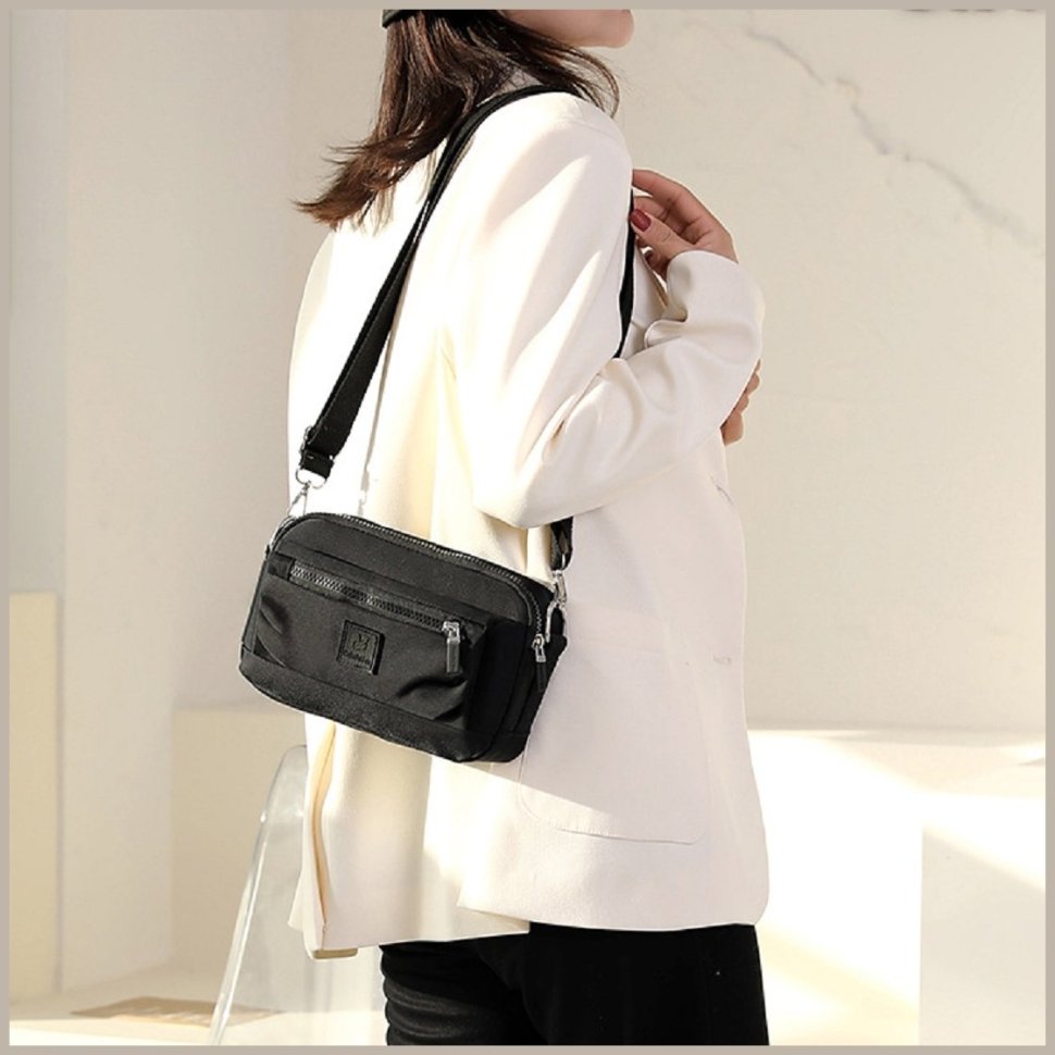 Жіноча текстильна сумка-кроссбоді чорного кольору через плече Confident 77608
