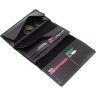 Крупный кожаный кошелек черного цвета с хлястиком на магните Grande Pelle 67810 - 9