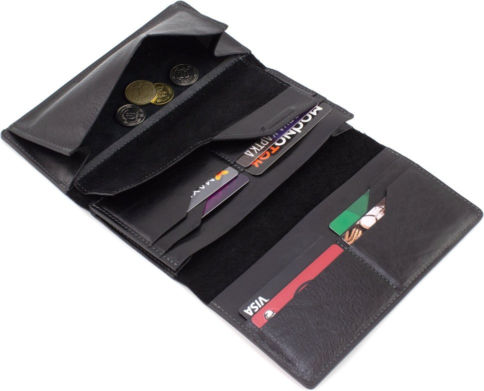 Великий шкіряний гаманець чорного кольору з хлястиком на магніті Grande Pelle 67810