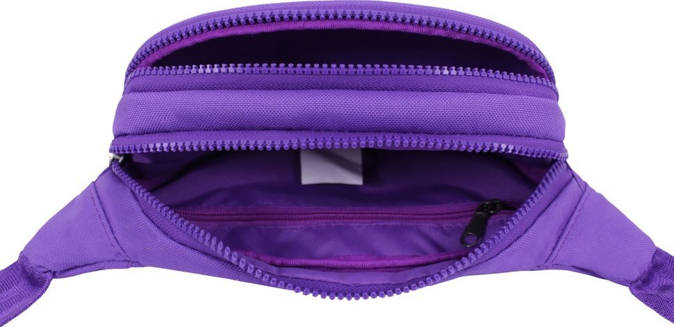 Яркая женская текстильная сумка-бананка фиолетового цвета Bagland (53812)