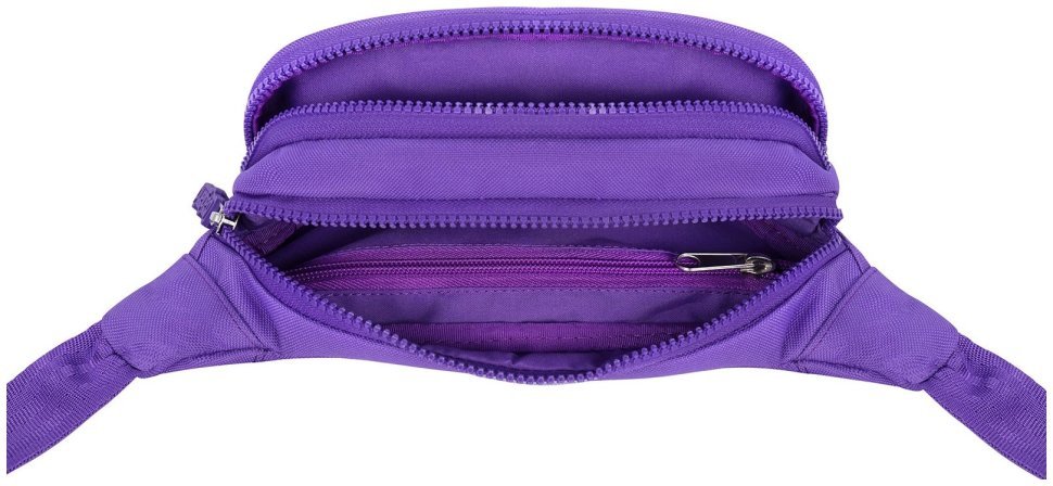 Яскрава жіноча текстильна сумка-бананка фіолетового кольору Bagland (53812)