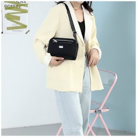 Невелика жіноча тканинна сумка-кроссбоді чорного кольору Confident 77614