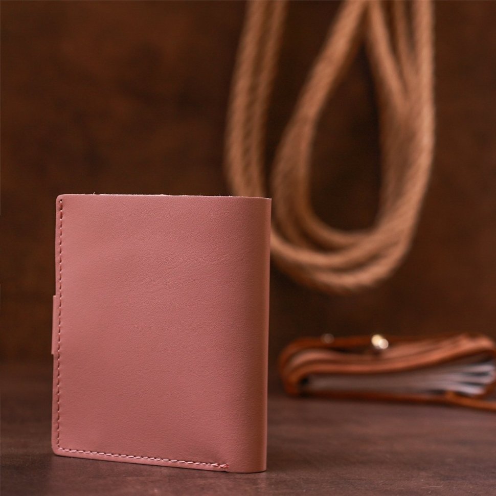 Рожевий жіночий гаманець з натуральної шкіри з хлястиком на кнопці Shvigel (2416509)