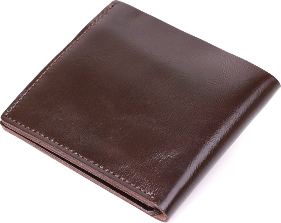Шкіряне чоловіче портмоне коричневого кольору з хлястиком на кнопці Shvigel (2416443)