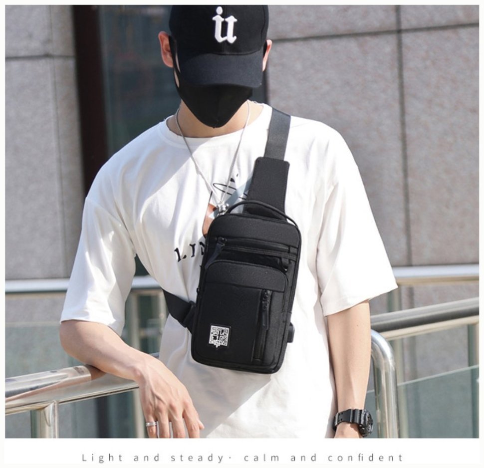 Повседневная текстильная мужская сумка-рюкзак через плечо в черном цвете Confident 77452