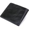 Чорне шкіряне чоловіче портмоне з фіксацією на хлястик та кнопку Shvigel (2416460) - 2