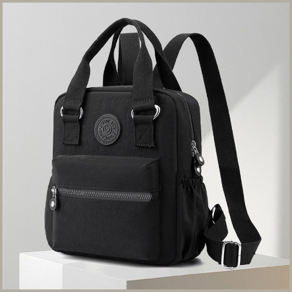 Тканинна жіноча сумка-рюкзак середнього розміру в чорному кольорі Confident 77569
