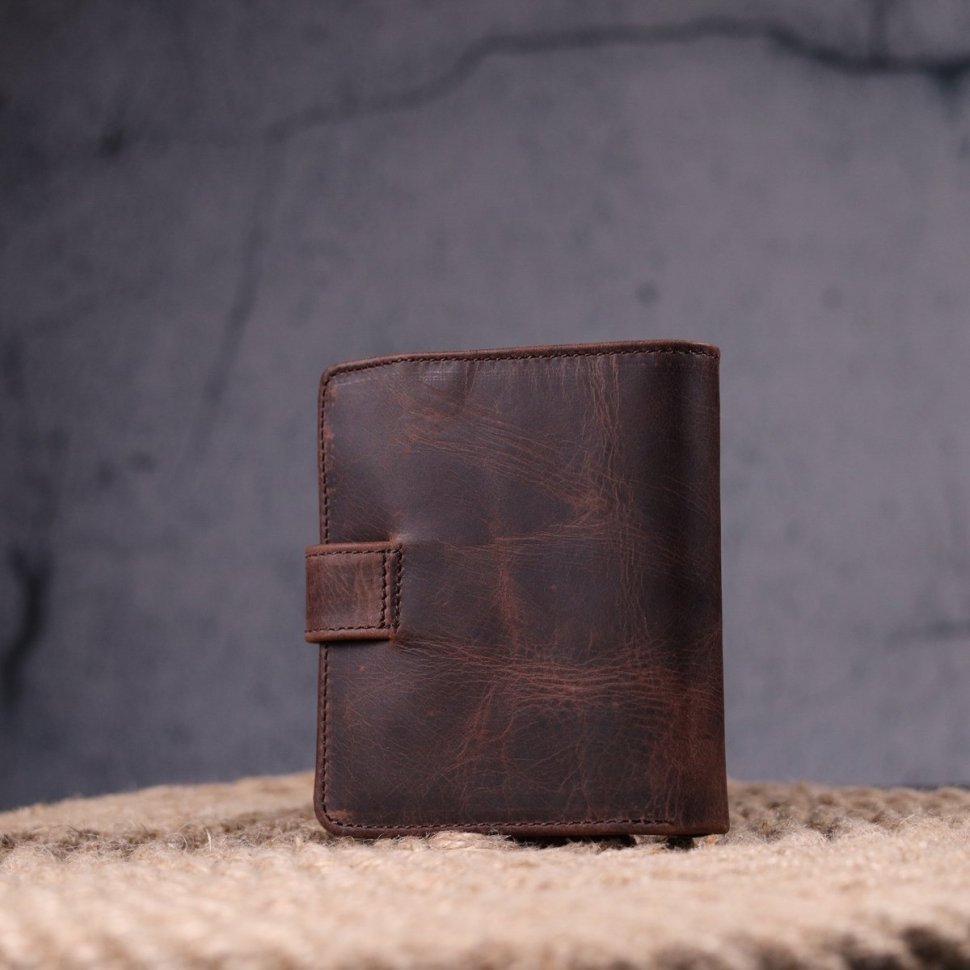 Темно-коричневое мужское портмоне из винтажной кожи с фиксацией на кнопку KARYA (2421372)