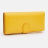 Большой яркий женский кошелек из кожзама с хлястиком на кнопке Monsen 109071 желтого цвета modnotak фото - 2