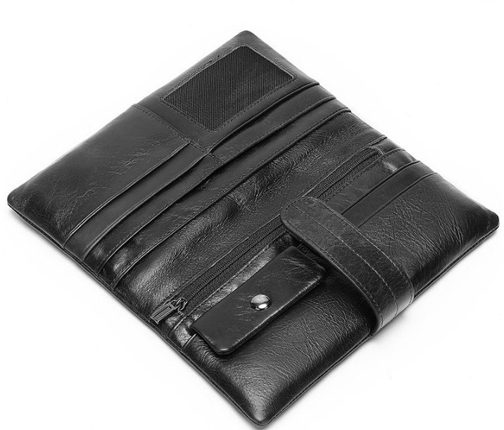 Добротний чоловічий гаманець-клатч із чорної шкіри з фіксацією на хлястик Bexhill (21510)