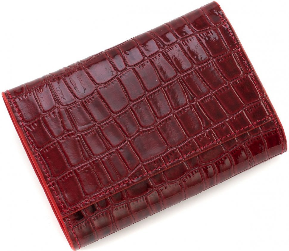 Шкіряний жіночий гаманець червоного кольору в три складання з тисненням KARYA (19981)