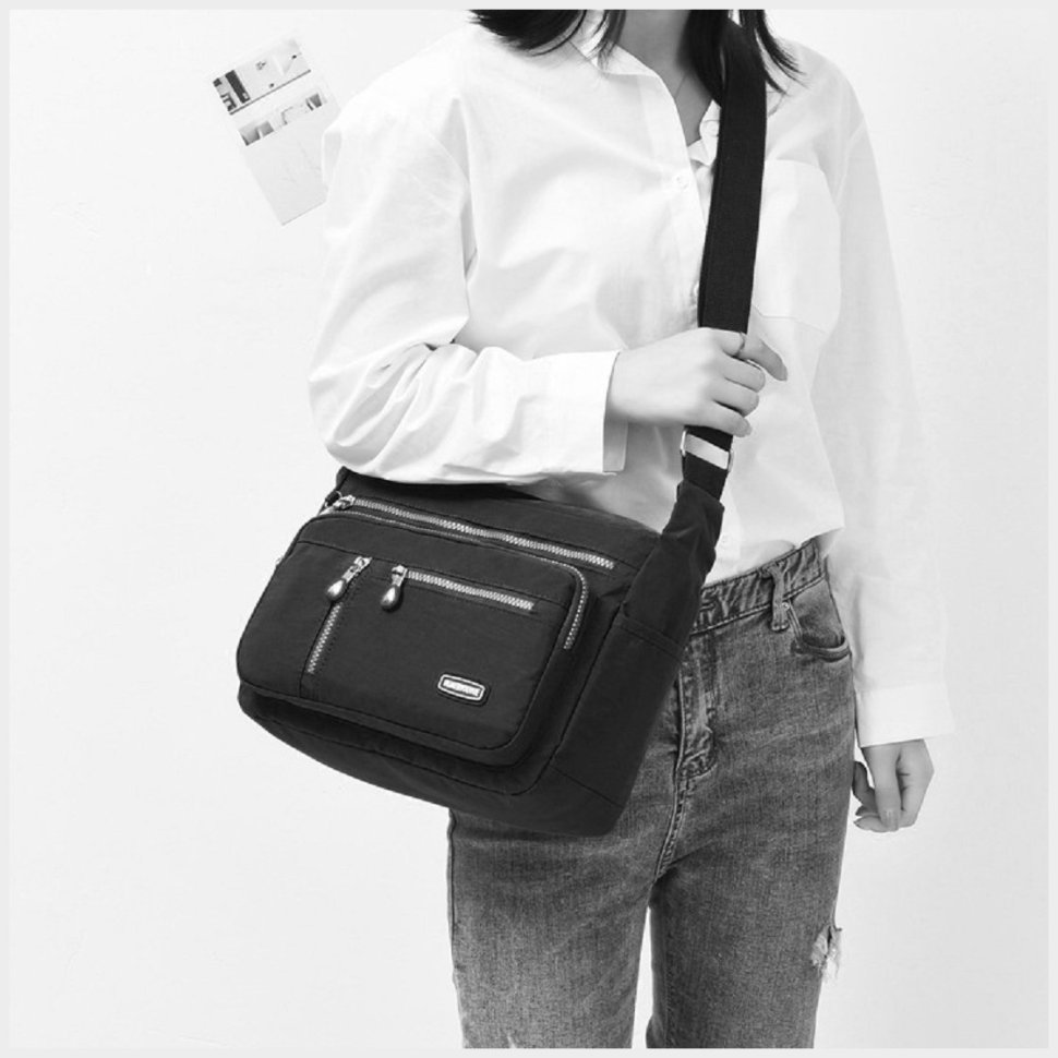 Женская наплечная сумка из качественного текстиля черного цвета Confident 77590