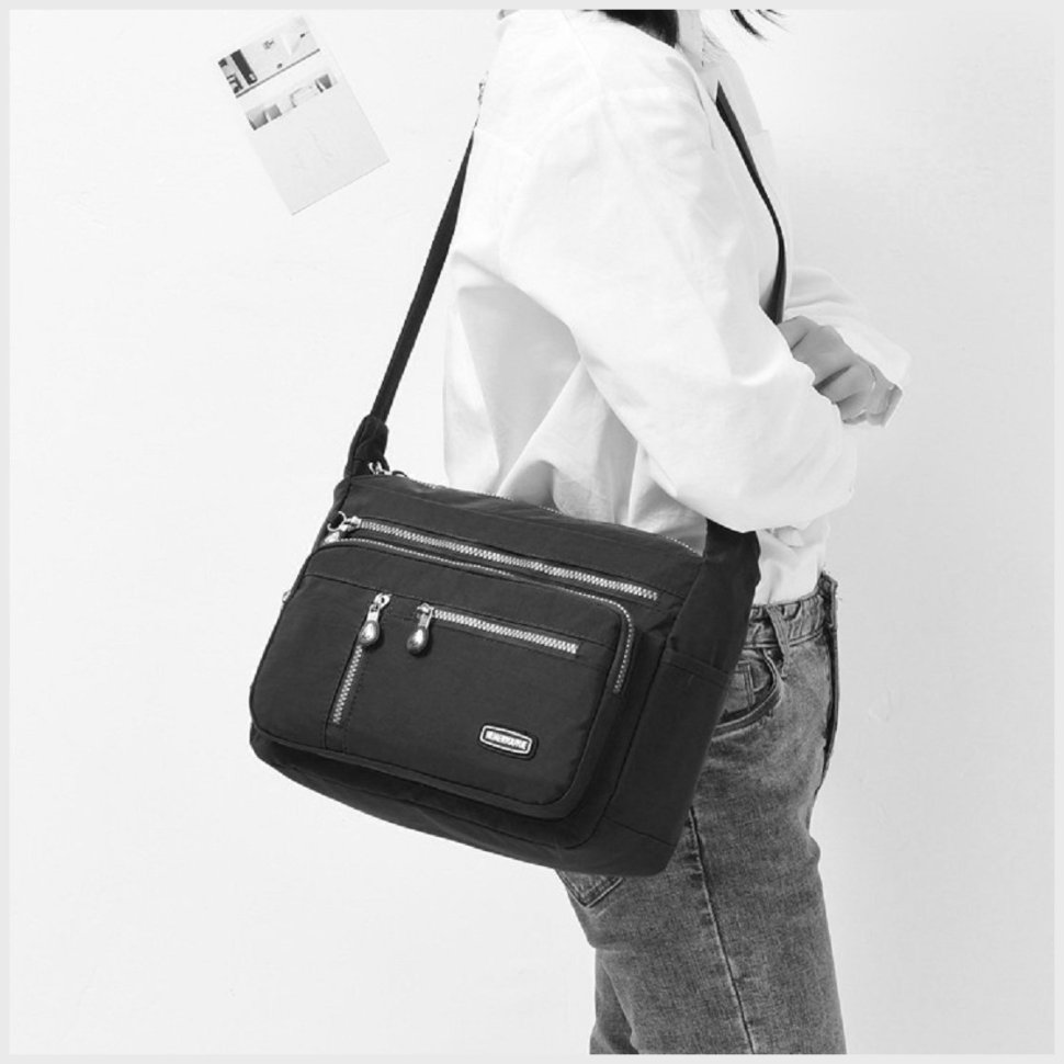 Женская наплечная сумка из качественного текстиля черного цвета Confident 77590