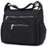 Простора жіноча сумка-месенджер чорного кольору з текстилю Confident 77594 - 1